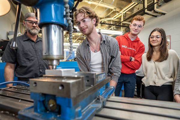 Mechanical engineering students working in a lab at the Lyle School of Engineering