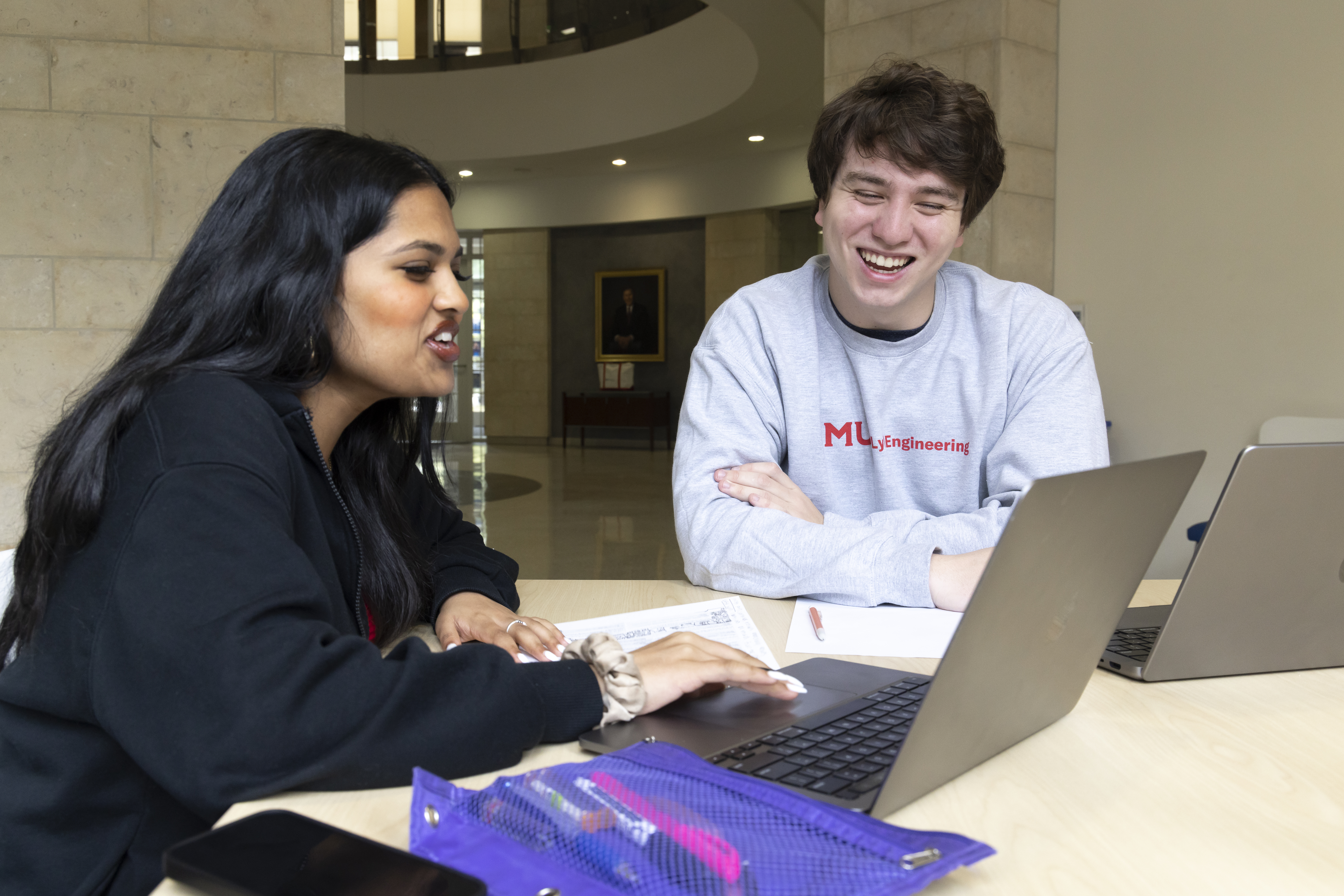 Lyle students smiling with laptops