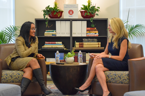 Two professionals sitting in the roundtable and having the conversation
