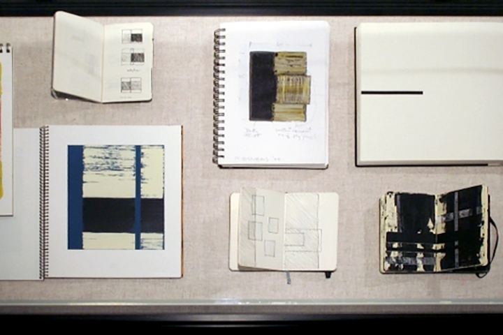 notebooks with drawings in black and neutrals