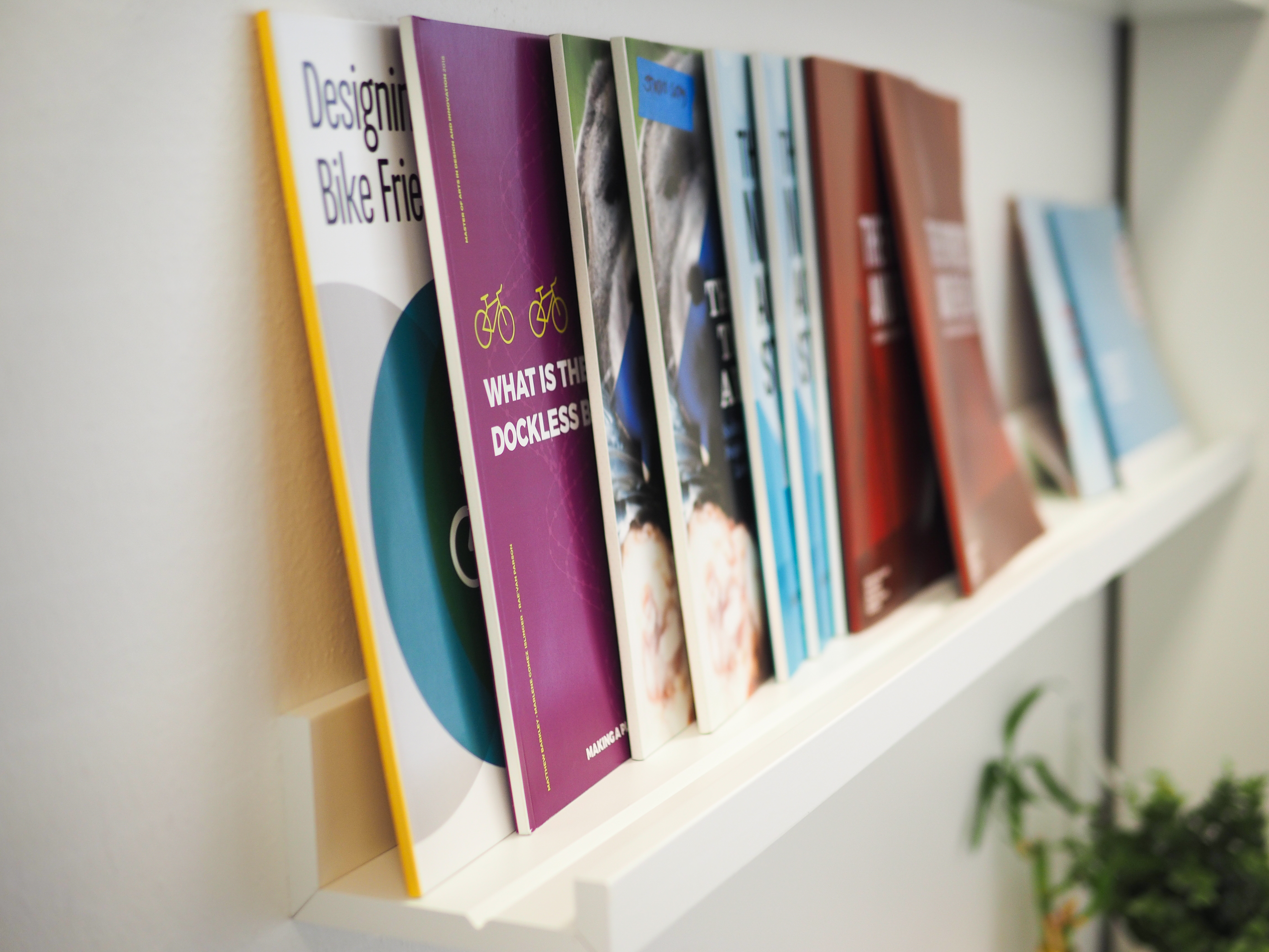 Multiple books are placed on the shelf.