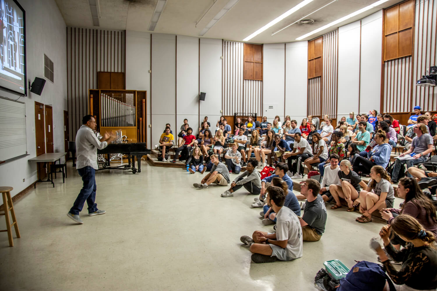 Person Teaching To A Crowd