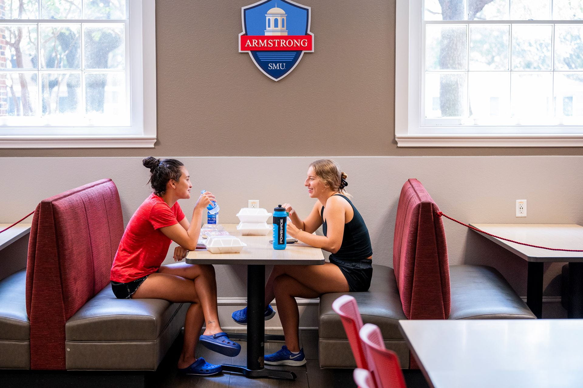 2 students dining at booth